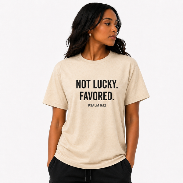 “NOT LUCKY. FAVORED.™ Premium Tee – Cream Edition